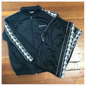 Tracksuit folded up at the black and brown thrift store