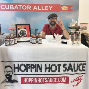 John in the hoppin hot sauce trade show booth